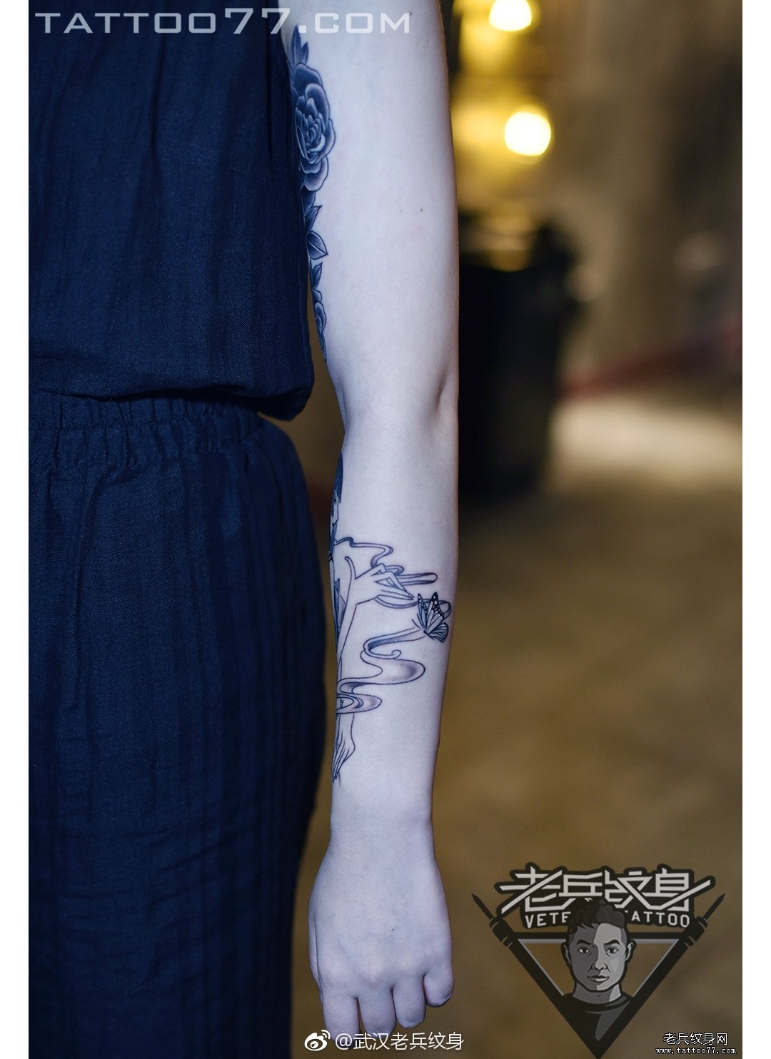 手臂女郎蝴蝶纹身图案