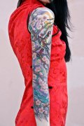 一款美女花臂喜鹊梅花纹身图案