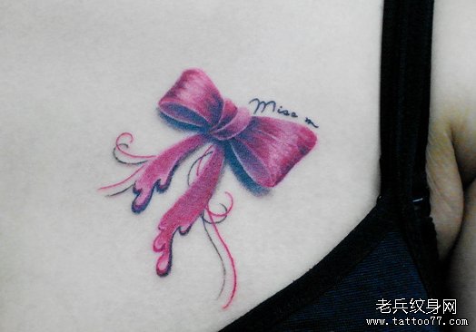 一款女性胸部彩色蝴蝶结tattoo图案由武汉纹身网推荐