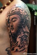 武汉纹身店推荐一款大臂佛纹身图案